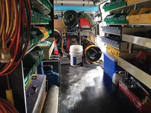Inside a Plumbers Express van, stocked with plumbing equipment